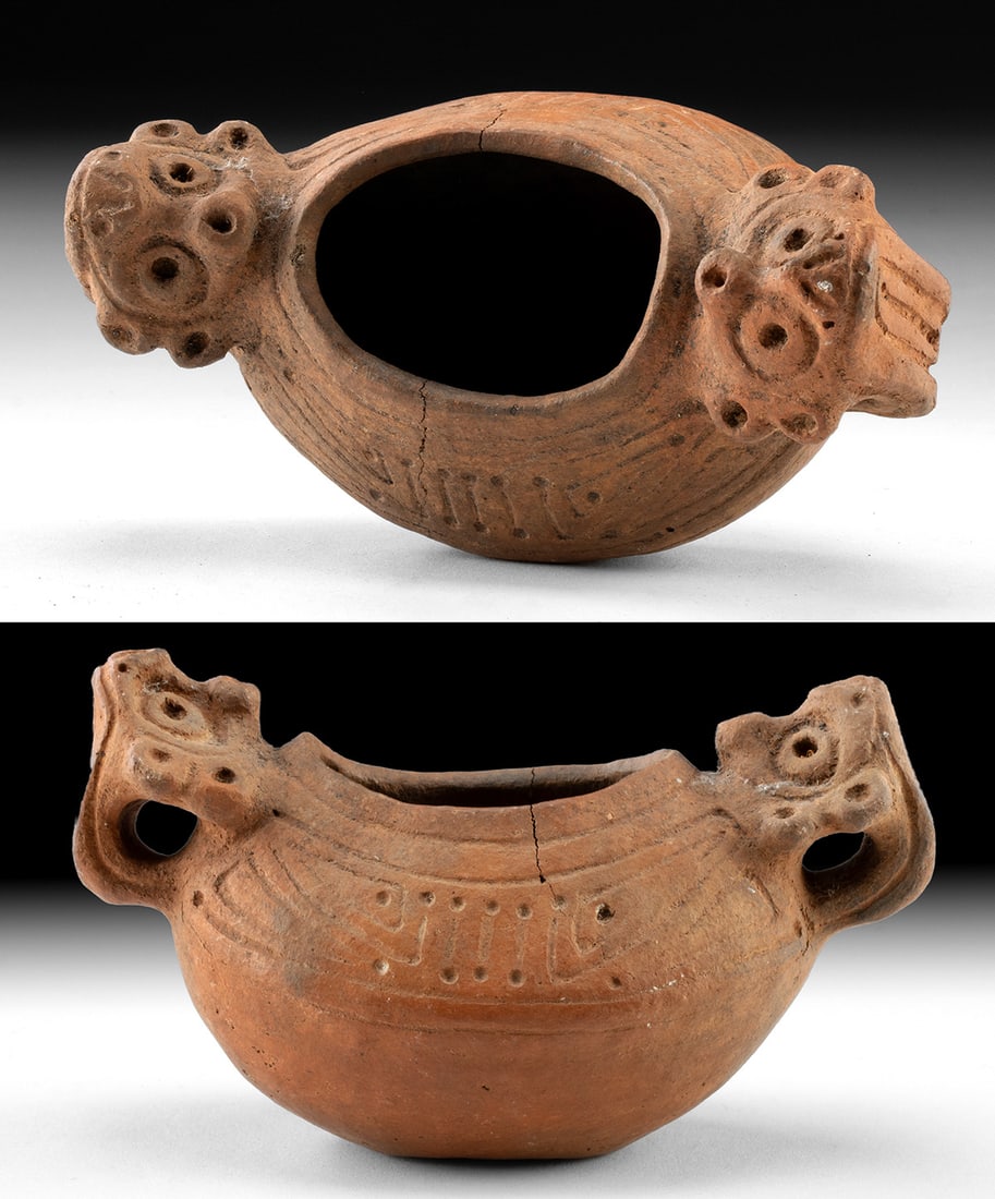 Caribbean Taino Pottery Bowl with Dual Effigy Heads: Pre-Columbian, Caribbean, Taino culture, ca. 1000 to 1500 CE. A finely modeled Taino pottery bowl animated by two opposing effigy heads, each projecting from the rim with watchful, circular eyes and o