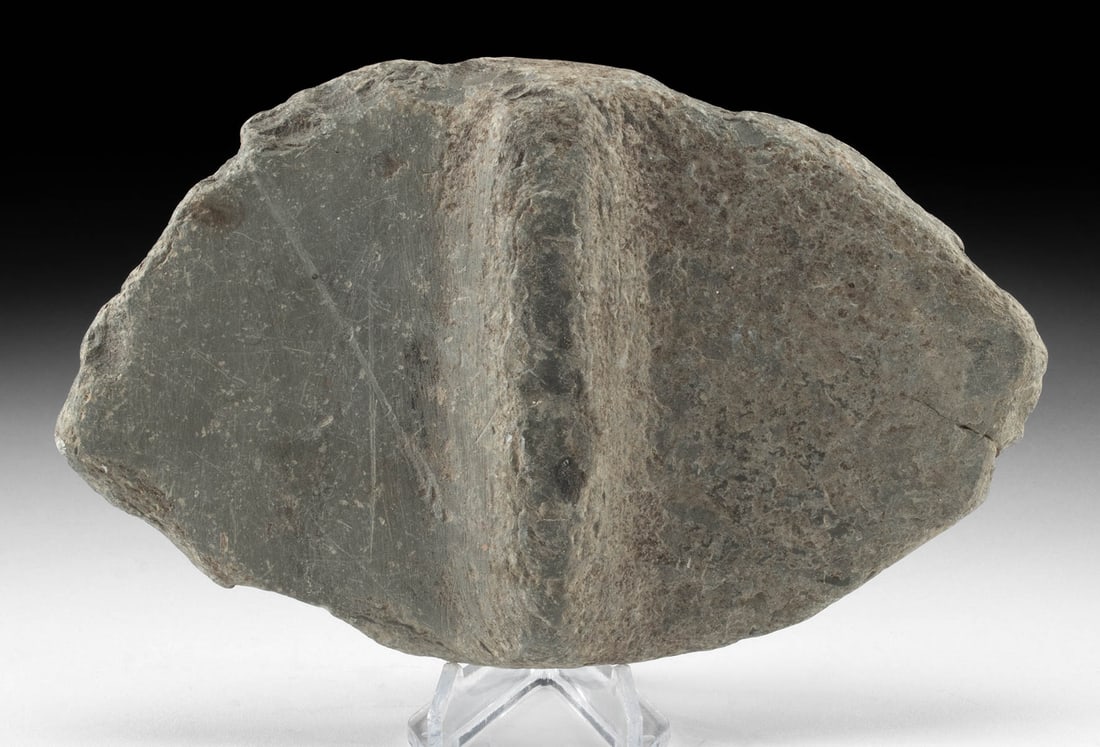 Large Unfinished Native American Archaic Bannerstone: Native American, United States, Archaic Period to Woodlands period, ca. 5000 to 1000 BCE. A large and impressive bannerstone carved from dense gray-green stone with a symmetrical lenticular profile ta