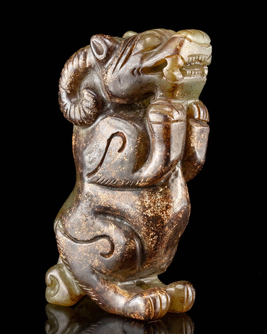 Qing Dynasty Stone Carving of Mythical Beast: East Asia, China, Qing Dynasty, ca. 19th to early 20th century CE. A compact Chinese stone carving from the Qing Dynasty depicting a mythical creature that blends features of a goat and a pixiu, carve