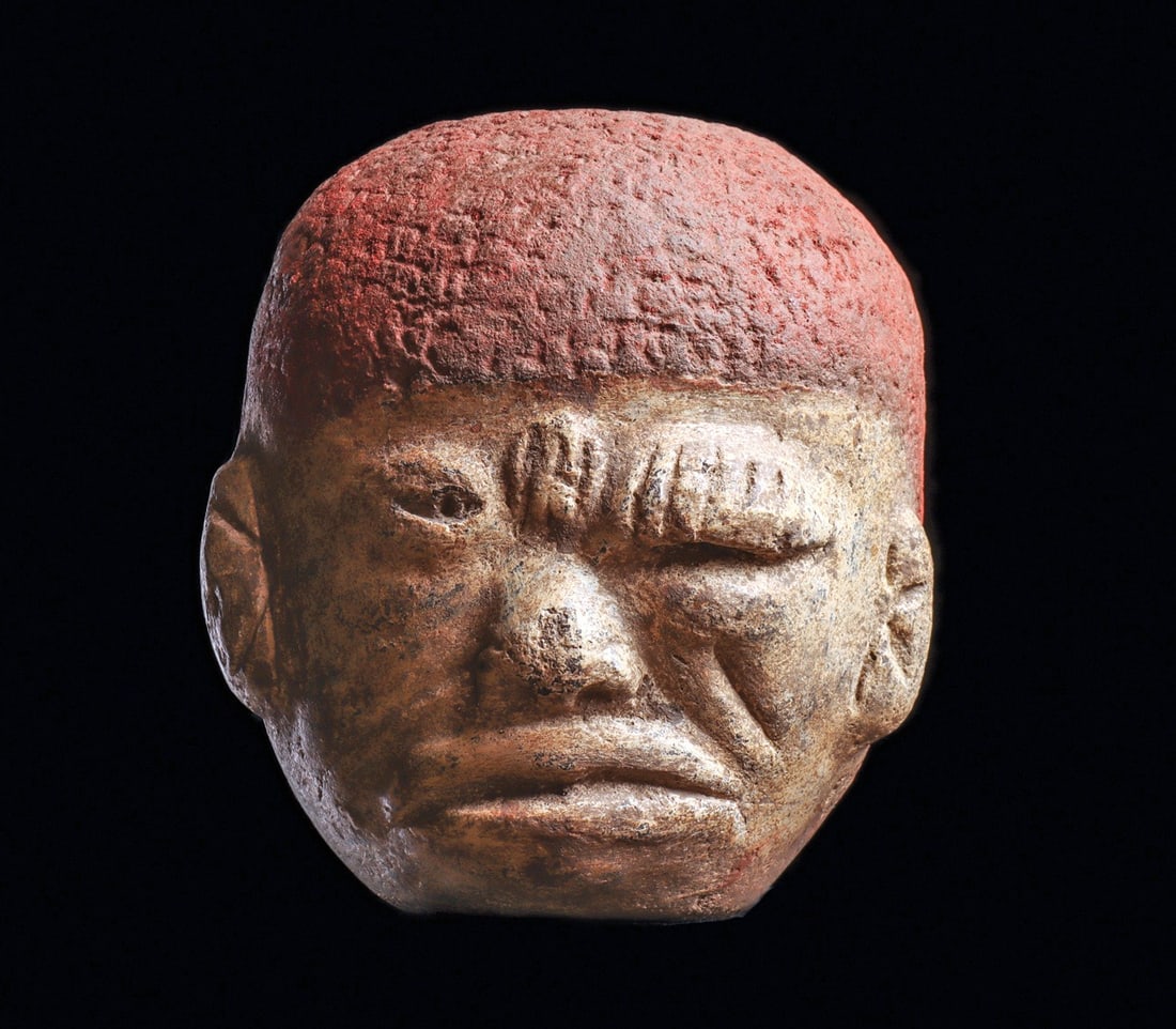 Olmec Effigy Head Bowl - Stroke Victim: Pre-Columbian, Olmec regions. Ca. 1000 - 600 BCE. Pottery bowl depicting the head of a stroke victim, having the left side of his face showing the results of a stroke. Face paint in cream slip and his