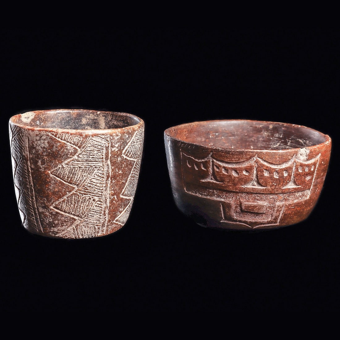 Olmec Decorated Bowls (2): Las Bocas, Olmec regions. Ca. 1000 - 600 BCE. Two different decorated small bowls, including a chocolate ware pottery bowl having a carved decorative element depicting a highly abstract jaguar eye and