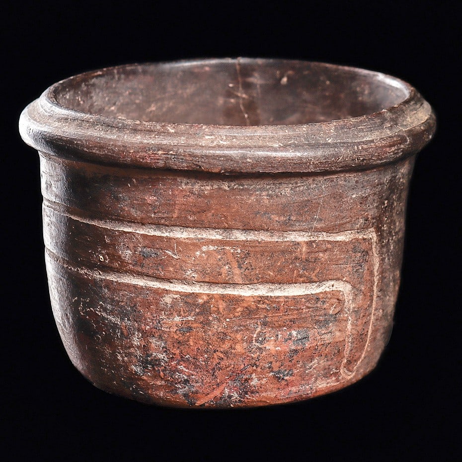 Olmec Pottery Bowl Incised Decoration: Olmec regions. Ca. 400 BCE - 250 CE. Mottled brown and black pottery bowl, having a lip rim and flat bottom. Simple incised decoration on both sides. Scattered surface and mineral deposits. A large or