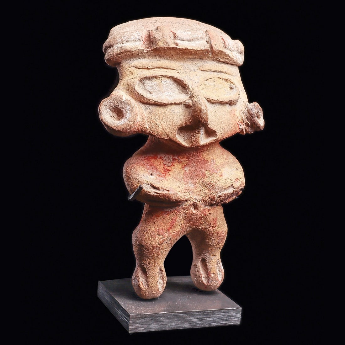 Museum-Exhibited Tlatilco Pretty Lady Figure, Type K: Tlatilco. Ca. 1150 - 550 BCE. Buff color, solid pottery standing figure with large eyes and holding both hands to stomach. Some remaining red, white and ocher pigment highlights. Restored left ear orn