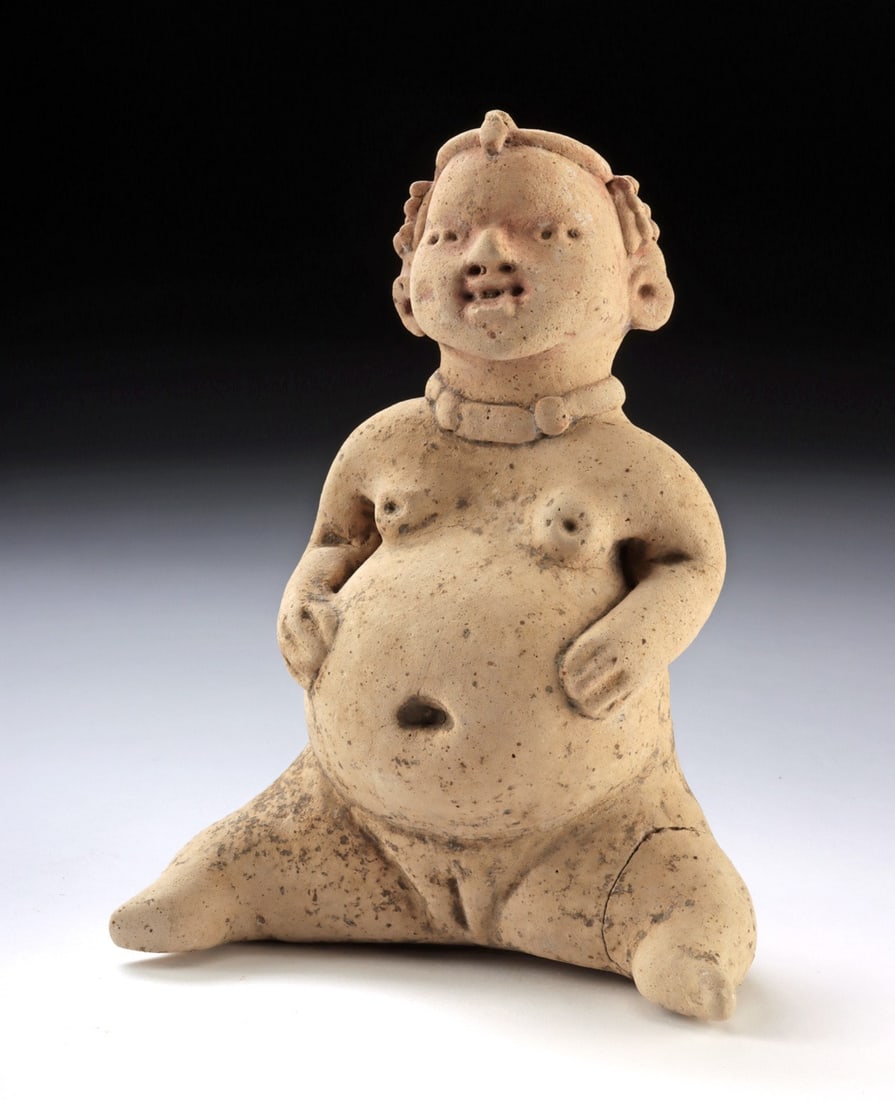 Tlatilco Seated Pregnant Fertility Figure, Elaborate Hairdo & Necklace: Pre-Columbian, Central Mexico, Tlatilco culture, ca. 1200 to 600 BCE. A seated pregnant woman whose rounded, fecund body declares its reproductive purpose without reservation - her distended abdomen, 