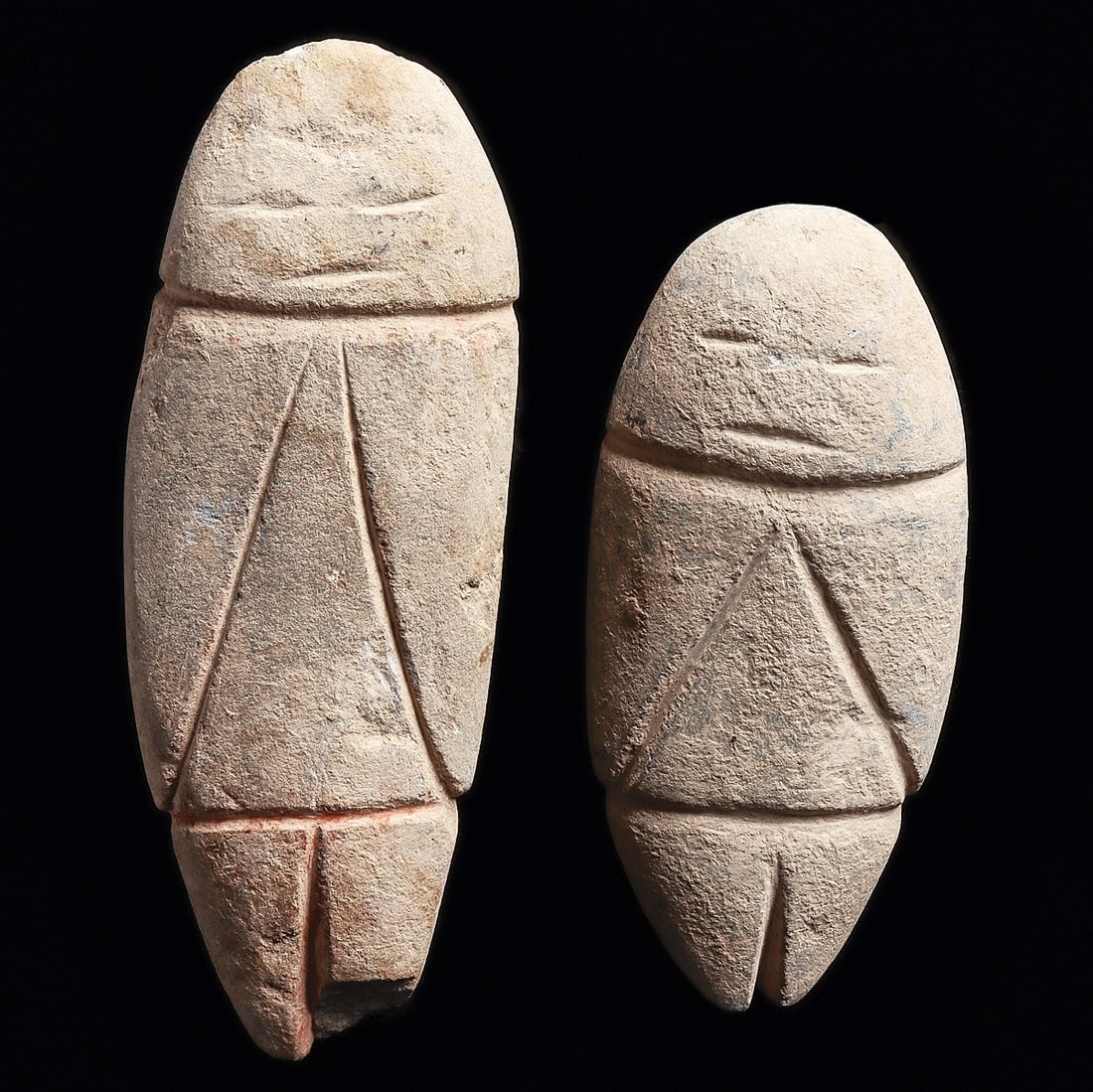 Guerrero Stone Idol Pair - Red Pigment Traces, Excellent Patina: Guerrero. Ca. 400 BCE. Two similar gray hardstone idols, both having simple linear incised facial features, arms and legs indicated, traces of red pigment in some of the low cut details. Overall excel