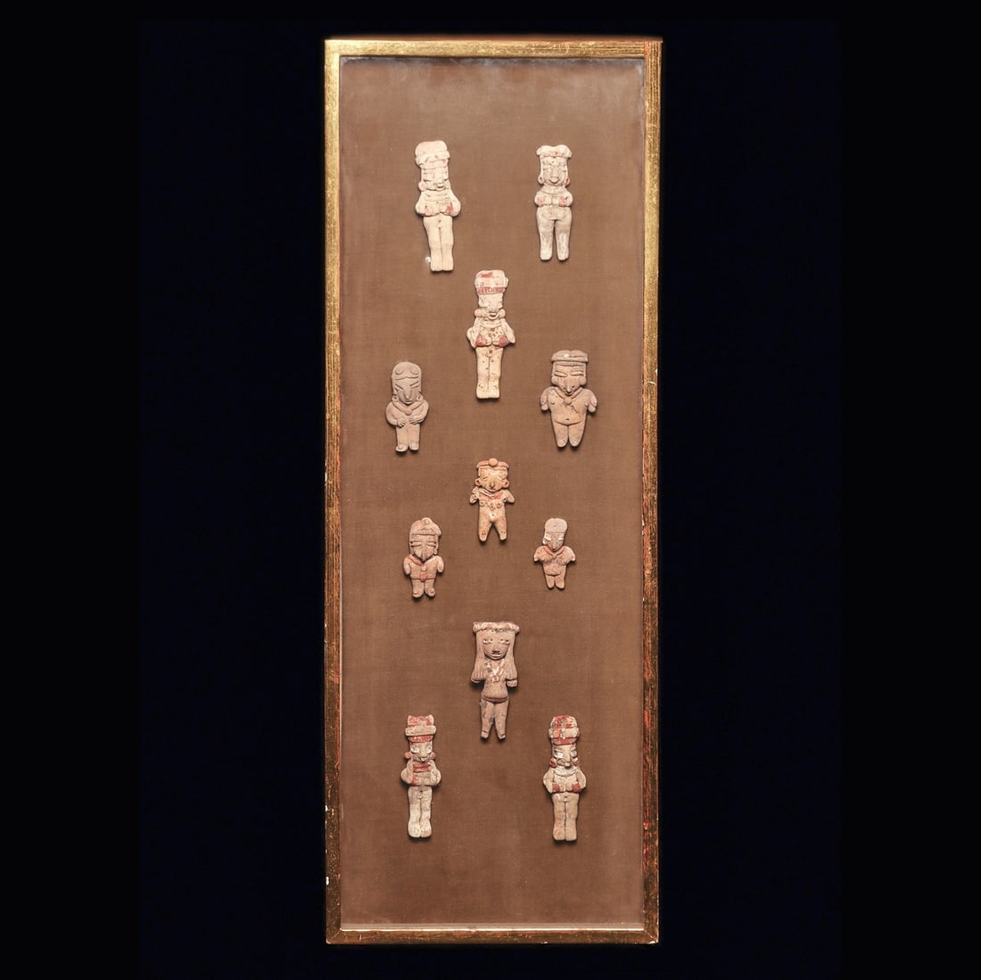 Group of 11 Chupicuaro & Michoacan Figures: Chupicuaro & Michoacan. Ca. 400 - 100 BCE. Group of eleven solid pottery Chupicuaro and Michoacan standing figures. All wearing necklaces, and most with decorated headbands. Several with some remainin