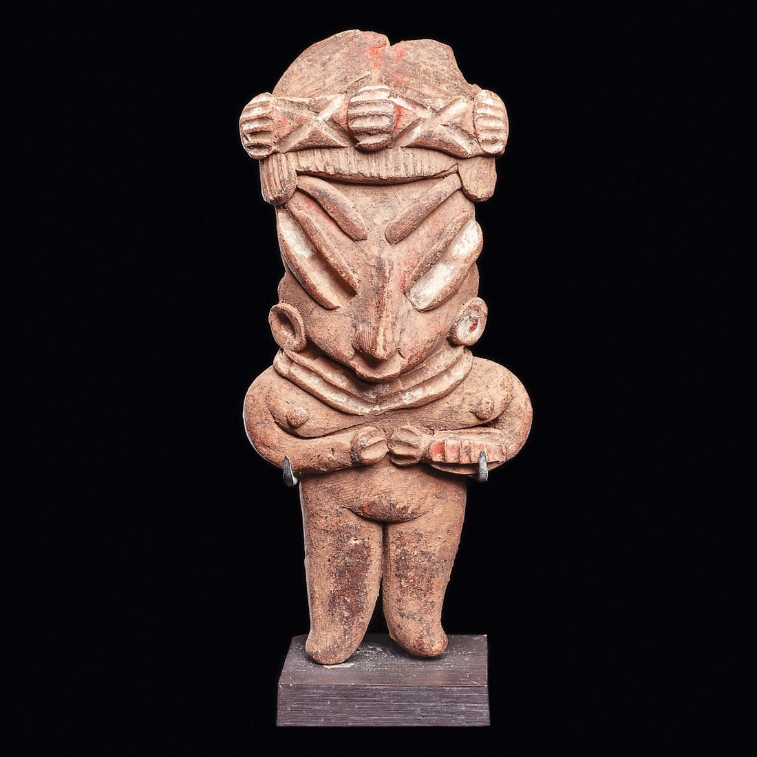 Chupicuaro Standing Pretty Lady Figure: Chupicuaro. Ca. 400 - 100 BCE. Buff color solid pottery standing “Pretty Lady” type figure, wearing a fancy decorated headband, striated hairdo, small disc ear ornaments and necklace. Some