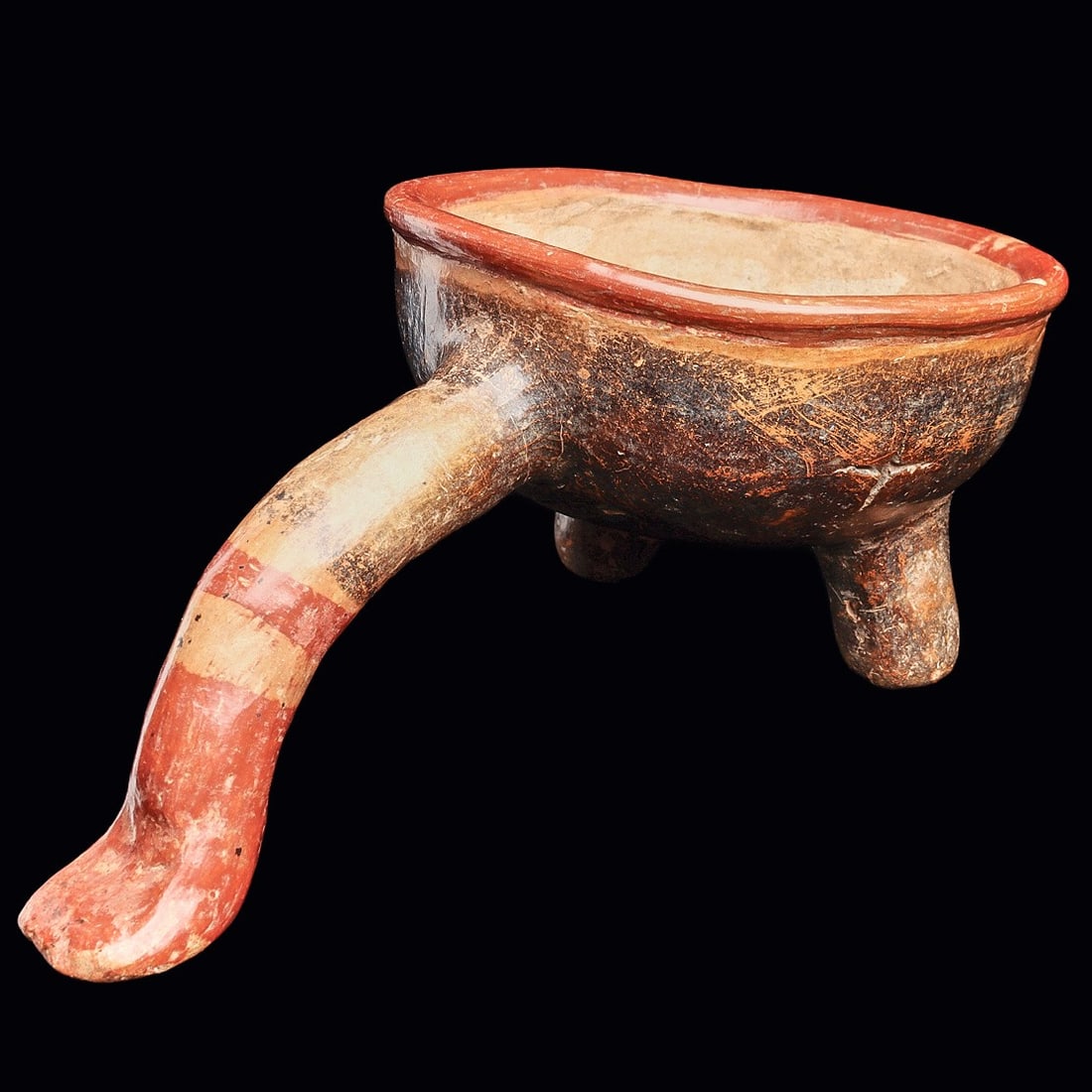 Aztec / Mixtec Incense Holder: Mixtec to Aztec Empire. Ca. 800 - 1250 CE. Polychrome decorated pottery incense holder, red and black on a tan ground, having a round bowl with a long rear curved support leg-handle with a stylized fo