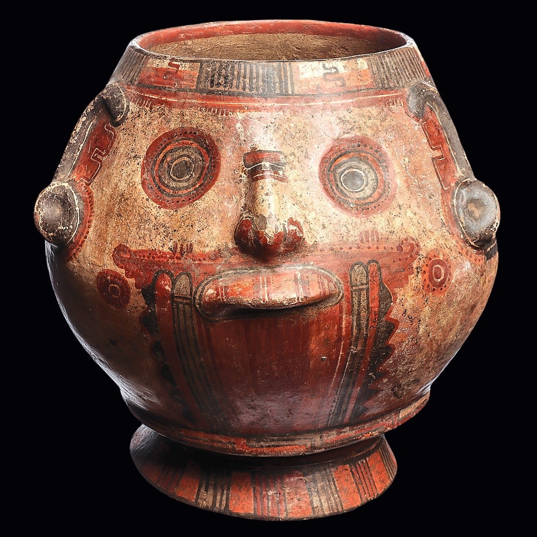 Costa Rica Head Vessel, Feline & Reclining Deity: Costa Rica. Ca. 600 - 1000 CE. Fine polychrome decorated pottery head vessel, with relief facial features, having finely painted details and decorated with a semiabstract feline in the center rear reg