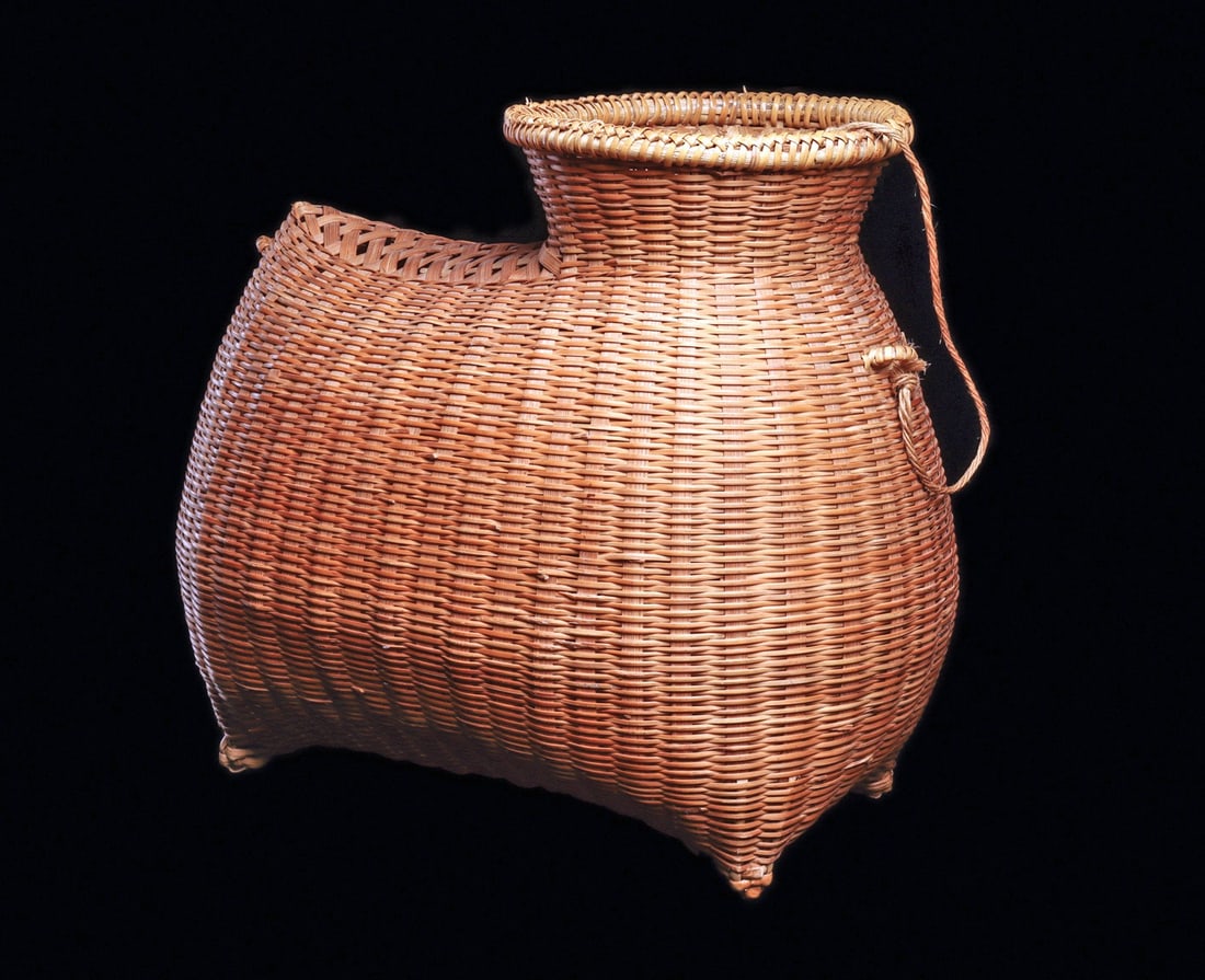 Fish Trap Basketry Vessel: Thailand.Expertly woven container in form of a bulbous zoomorph on short pointed legs with a short loop tail, fiber strand attachment in front at flared neck with flexible opening. Tan-brown rattan ba