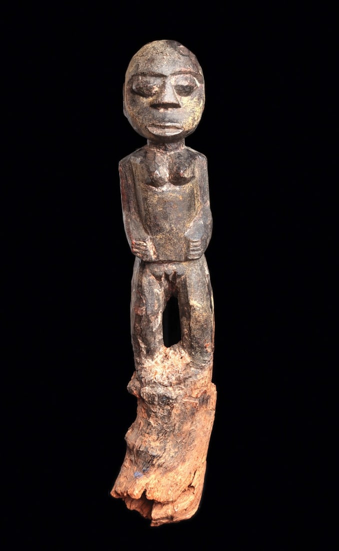Fon Fetish Figure: Republic of Benin (formerly Dahomey). “Bocio” figure, made for protection or harming an enemy or ensuring success. Originally on a long cylindrical support that is now broken off, the fema