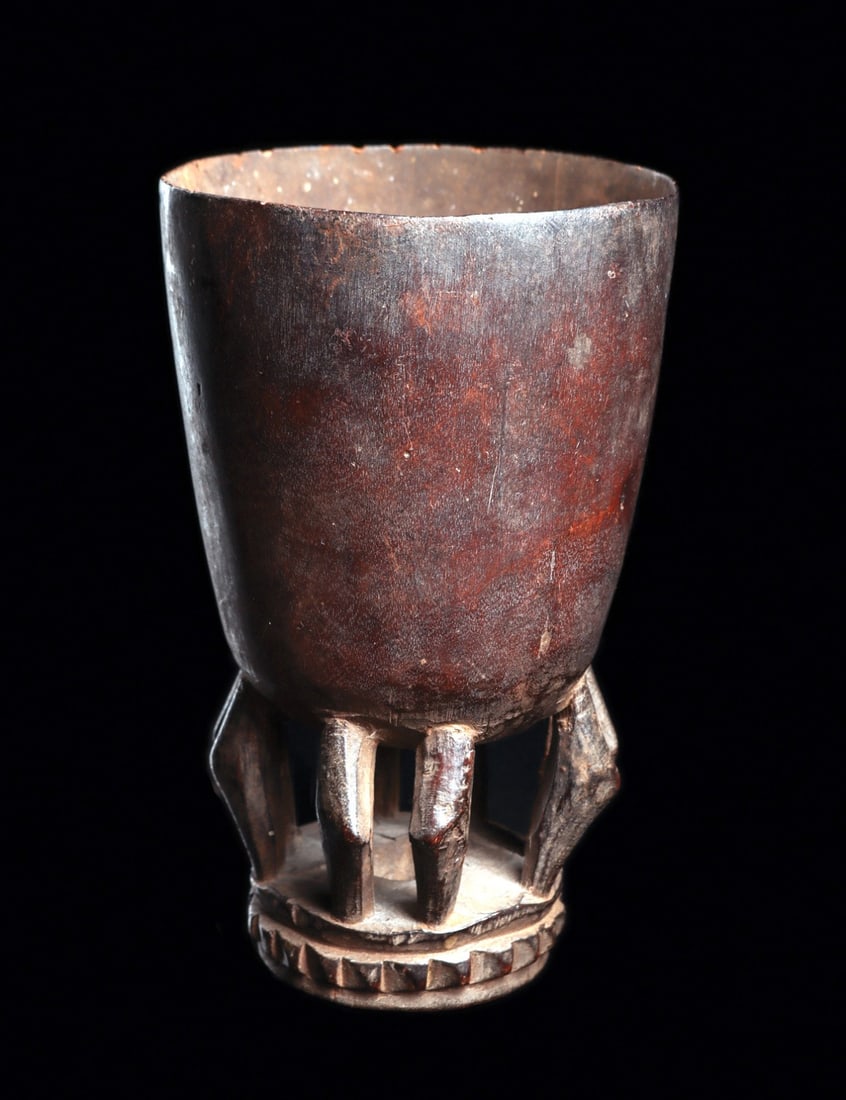 Ceremonial Cup: Republic of Benin (ex. Dahomey). Probably Fon carved wood cup on disk base with four pairs of anthropomorphic caryatid legs slightly bent set at four cardinal points. Supporting delicately carved thin