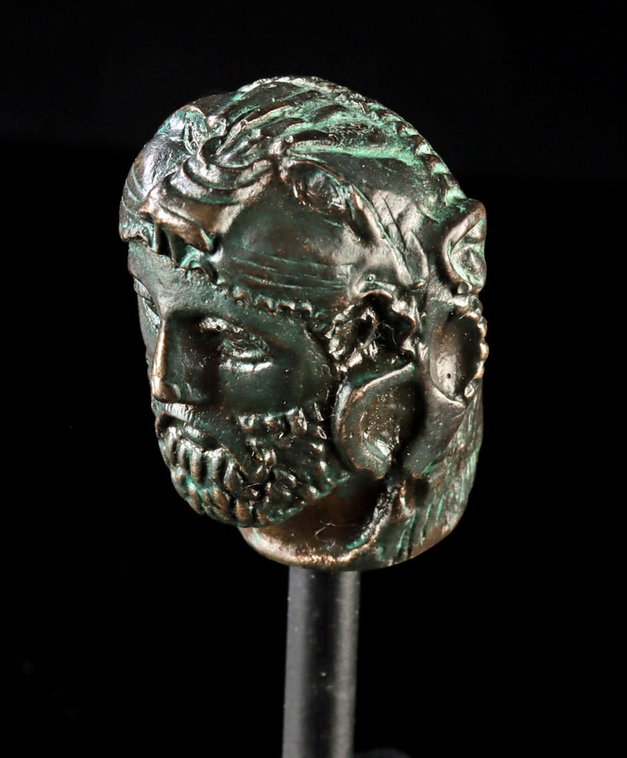 Greek Bronze Attachment of Alexander the Great: Hellenistic Greek, Magna Graecia, ca. 300 to 250 BCE. Exceptionally well-modeled bronze head of Alexander the Great. Cast bronze highly detailed bust with lion-skin cape crowning his head, almond-shap