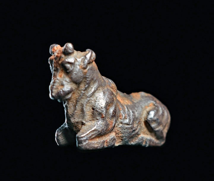 Hellenistic Greek Miniature Bronze Votive Bull: Magna Graecia. Hellenistic, ca. 1st century BCE - 1st century CE. Fine cast miniature solid silver reclining bull, having small pointed horns and ear pulled back. Overall beautiful and fine realistic 