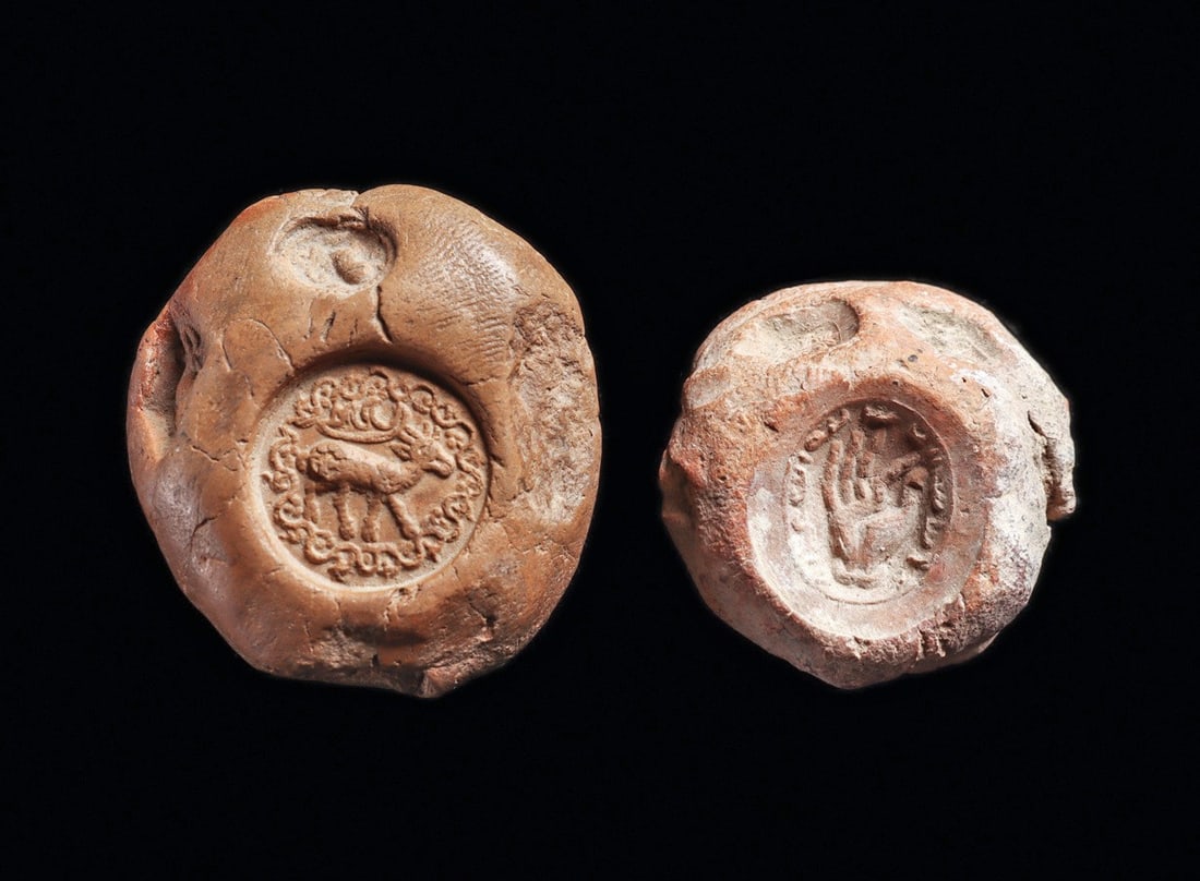 Sasanian Bullae with Hand & Animal Impressions (2): Sasanian Empire. Western Asia. Ca. 5th - 6th century CE. Two different pottery bullae, each originally attached to a document or merchant bundle, both have a stamp impression. The slightly larger exam