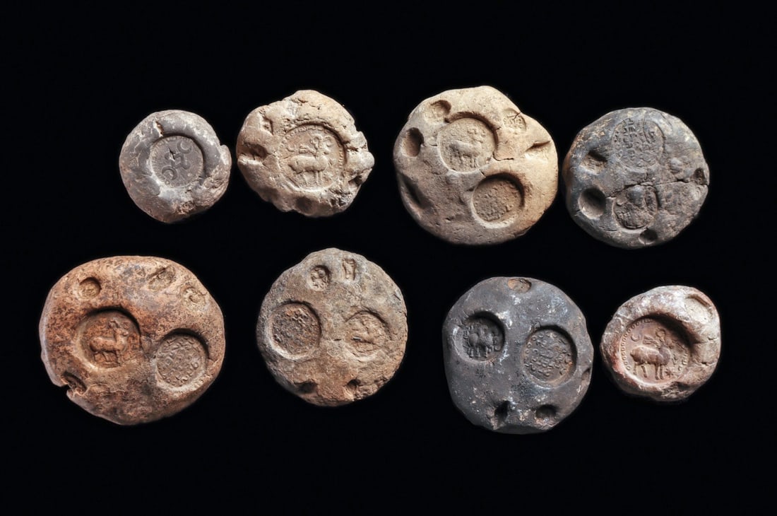 Sasanian Bullae with Various Stamp Impressions (8): Sasanian Empire. Western Asia. Ca. 5th - 6th century CE. Eight different pottery bullae, each originally attached to a document or merchant bundle, all having stamp impressions including a winged hors