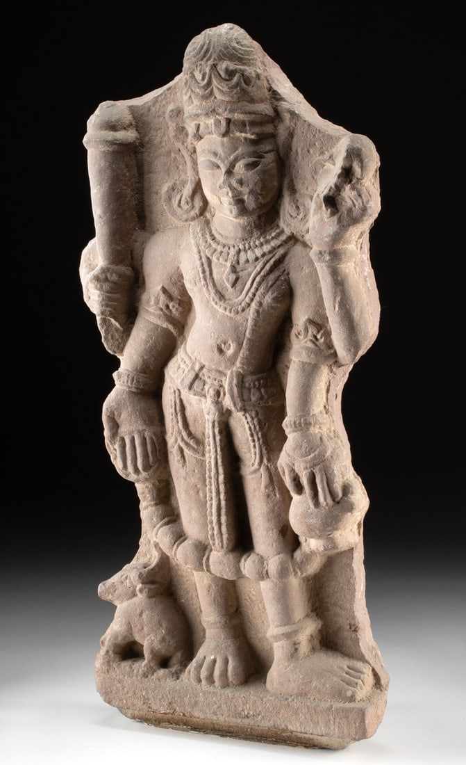 10th C. Indian Red Sandstone Frieze / Stele Panel Lord Shiva: South Asia, India, ca. 10th to 12th century CE. A red sandstone frieze / stele panel carved in high relief with a tribhanga-standing Shiva, presented frontally with a calm expression, tall tiered head