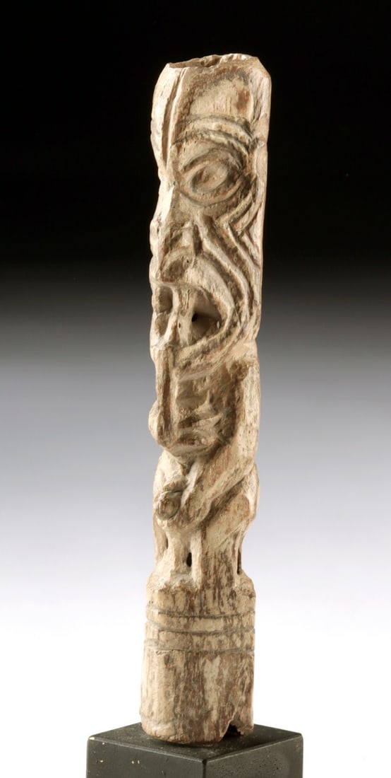 La Tolita Carved Bone Phallic Male Effigy | Fanged Shamanic Figure: Pre-Columbian, Ecuador, La Tolita culture, ca. 350 BCE to 400 CE. A compact yet arresting carved ungulate bone effigy depicting a nude male figure standing on an integral plinth, his bent legs and for