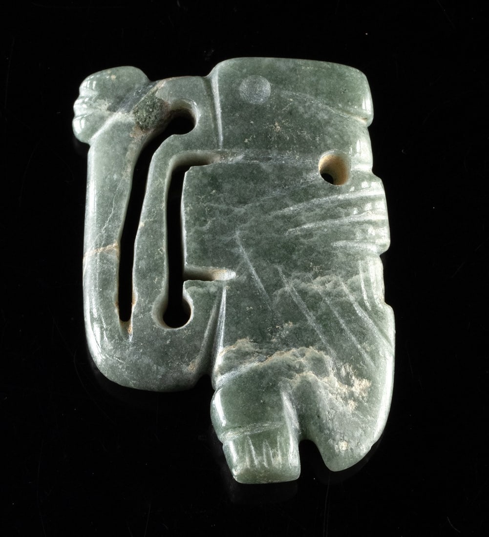Costa Rican Greenstone Bird Amulet - Openwork Beak: Pre-Columbian, Central America, Costa Rica, ca. 700 to 900 CE. A compact and beautifully abstracted bird amulet, carved in dense green stone with a quiet, ceremonial presence. The figure is rendered w