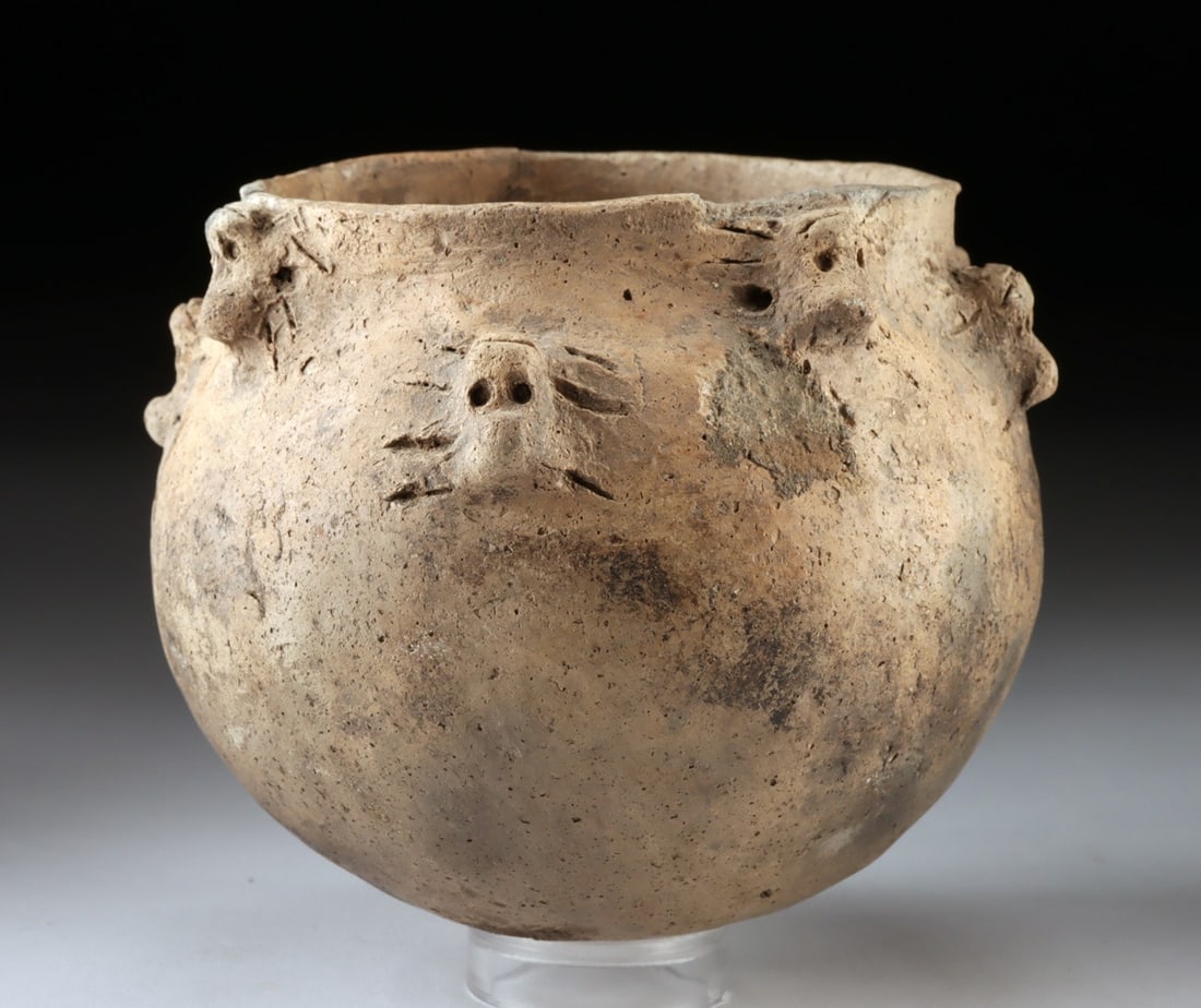 Mississippian Pottery Jar with Faces: United States, Native American, Mississippian Valley, Mississippian culture, ca. 1000 to 1500 CE. A compelling globular jar animated by a ring of small modeled faces around the shoulder, each with pai