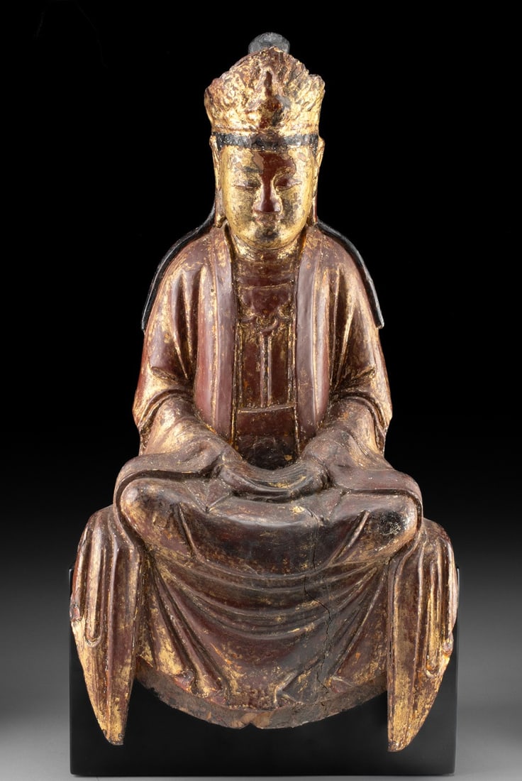 18th C. Chinese Gilt & Lacquered Wood Seated Guanyin: East Asia, China, Qing Dynasty, ca. 18th century CE. Envision the serene presence of Guanyin, the Bodhisattva of Compassion, captured in this 18th-century sculpture. Carved from wood and adorned with 