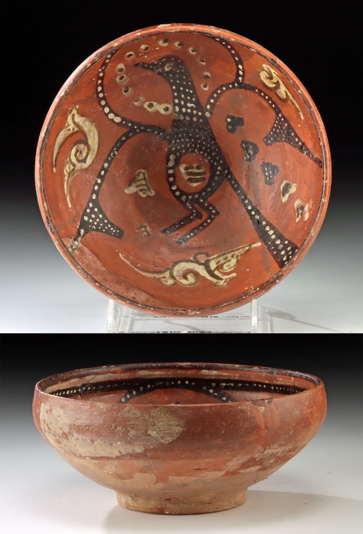 9th C. Persian Nishapur Pottery Bowl Bird Motif: Near East / Central Asia, Persia, Nishapur, ca. 9th to 11th century CE. A wheel-thrown pottery bowl featuring a rounded body on a ring-form foot, all enveloped in a rich terracotta-hued slip. The inte