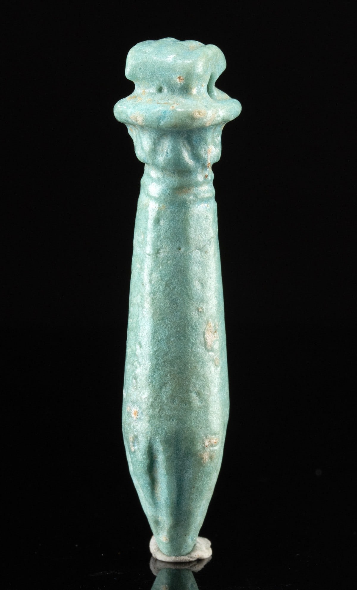 Egyptian Faience Amulet of Papyrus Scepter: Ancient Egypt, Late Period, ca. 664 to 332 BCE. A faience amulet in the form of a papyrus scepter, known in ancient Egyptian as a “wadj”, symbolizing regeneration and enduring life. The am