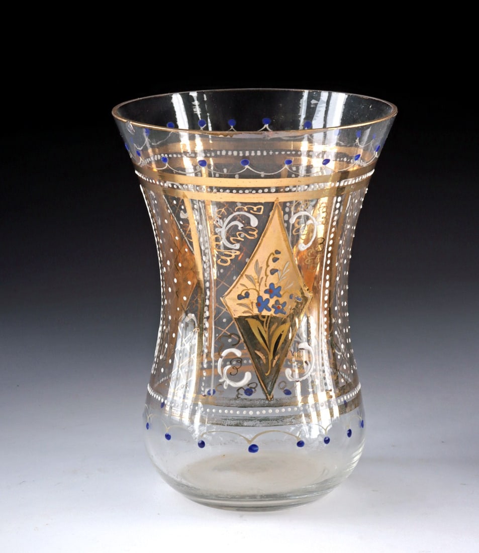 Vintage Turkish Gilt and Enamel Glass Cup: Near East, Turkey, ca. early to mid-20th century CE. A refined Turkish glass cup of waisted form, decorated with gilt geometric panels, delicate white scrollwork, and cobalt-blue enamel accents that s