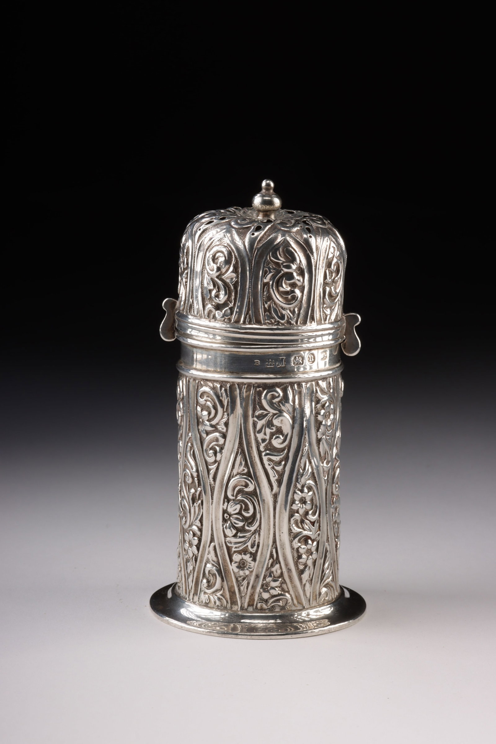 19th C. Sterling Silver Muffineer, Henry Matthews: Northern Europe, England, Birmingham, Victorian period, ca. 1894 CE. A sterling silver muffineer of confident Victorian manufacture, its cylindrical body rising from a stepped circular foot to a domed