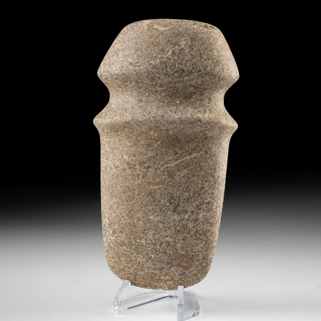 Native American Stone Full-Grooved Axe Head: Native American, Eastern Woodlands, ca. 1000 BCE to 1000 CE. A fully ground and polished granite axe head of the full-grooved type, its biconical form tapering to a rounded poll opposite the cutting e