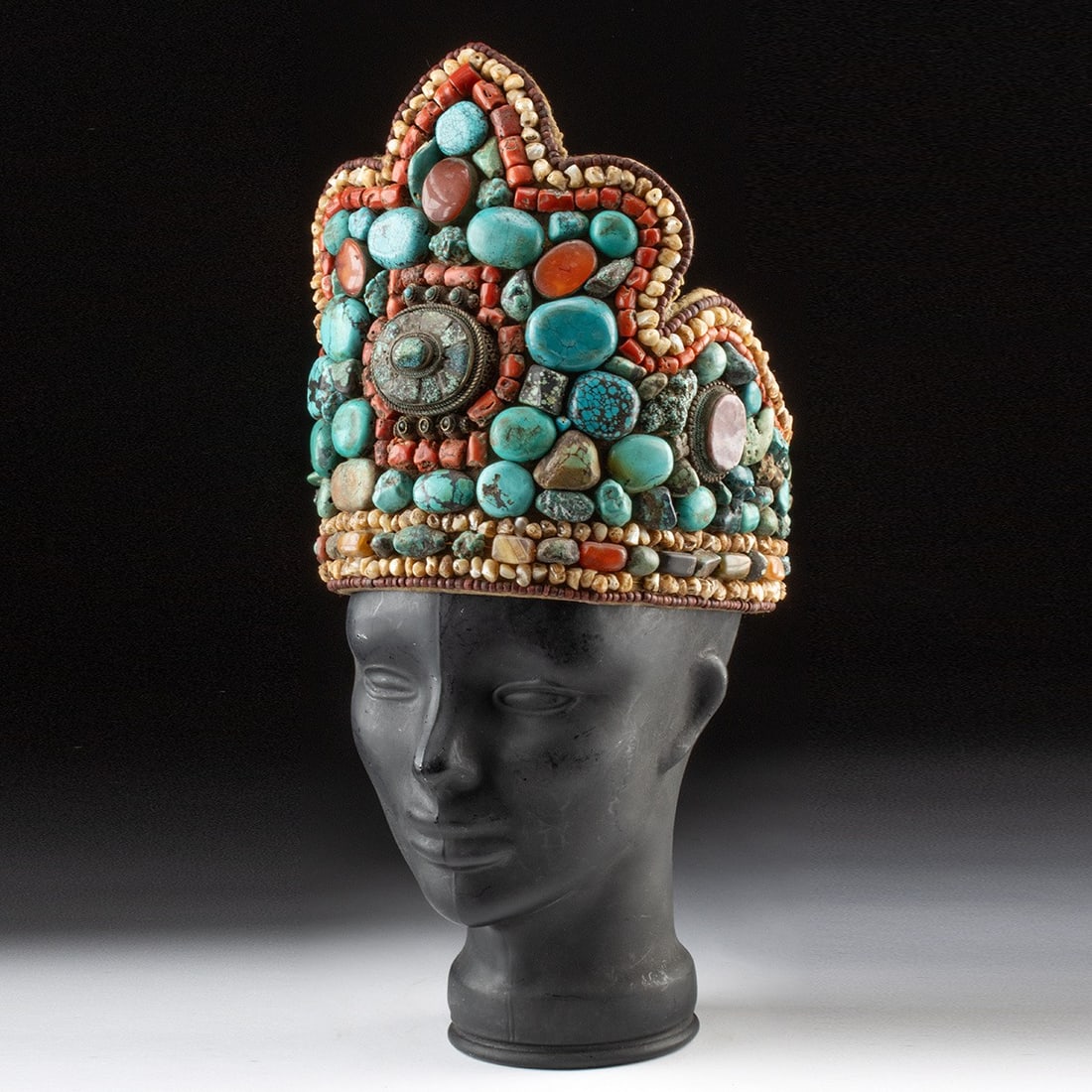 Ladakhi Perak Headdress w/ Turquoise & Amethyst: South Asia, India, Ladakh region, Ladakhi culture, ca. 20th century CE. A perak, the iconic ceremonial headdress of Ladakhi women, its trilobed crown form encrusted with turquoise, amethyst, coral, ca