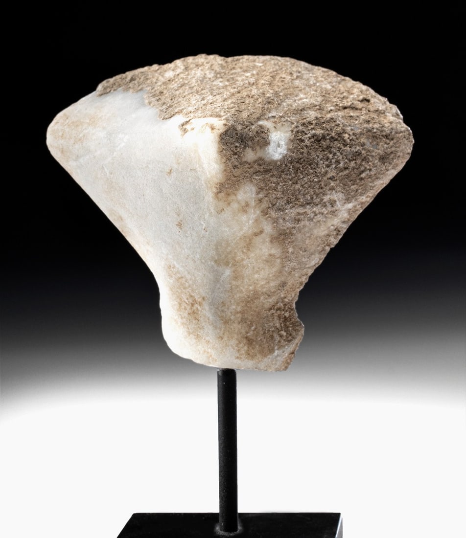 Large Anatolian Marble Kilia Idol Head: Ancient Near East, Anatolia, Turkey, Early Bronze Age II, ca. 2800 to 2200 BCE. A graceful hand-carved marble head of an extremely simplified anthropomorphic form. A thin neck rises up then flares to 