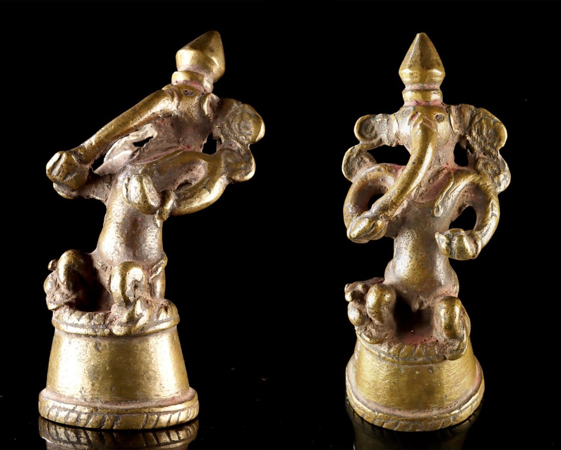 18th C. Indian Ganesha Figurine with Rat: South Asia, India, ca. 18th century CE. A diminutive yet expressive brass figurine of the elephant-headed god Ganesha, richly imbued with symbolic presence despite its small scale. The deity is shown 