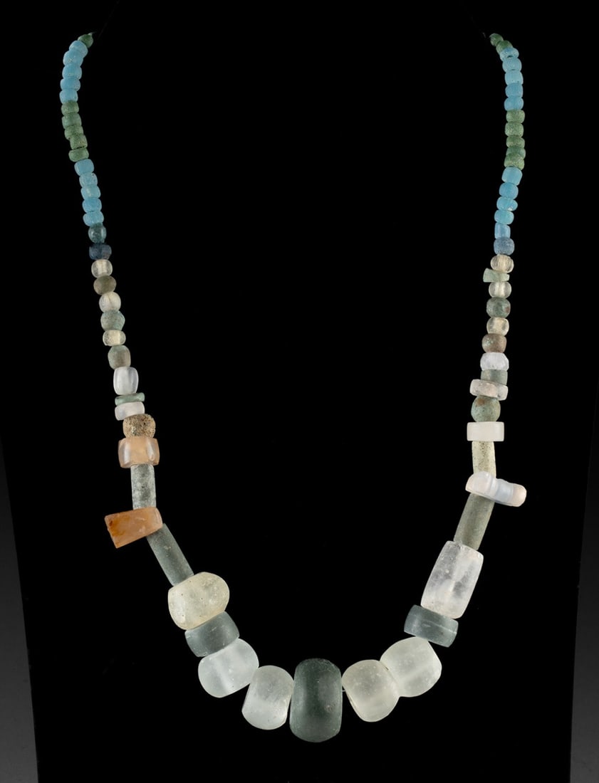 Multi-Cultural Stone, Faience & Glass Bead Necklace: Eastern Mediterranean and Europe, including Persian, Egyptian, Roman, and Frankish cultures, ca. 12th century BCE to 20th century CE. A remarkable strand of ancient beads unites more than three millen