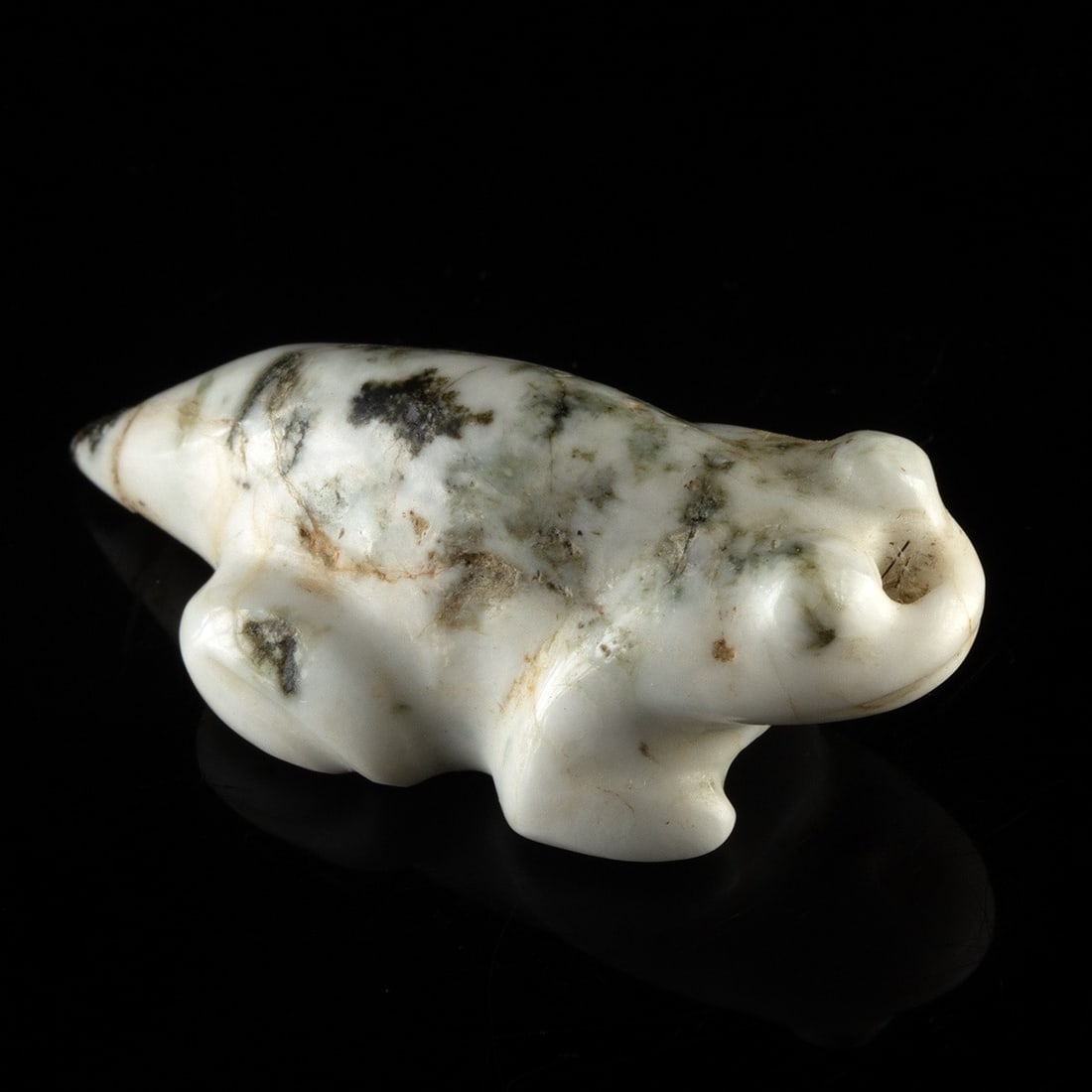Zuni Tree Agate Metamorphic Frog Fetish: Native American, Southwest, Zuni Pueblo, ca. 20th century CE. A frog fetish carved from tree agate, the white chalcedony body threaded throughout with dendritic dark inclusions that spread across the 