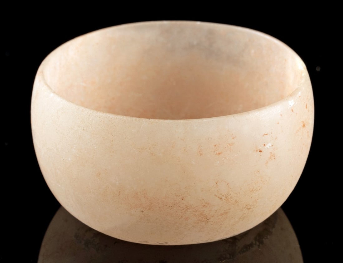 Rare Mesoamerican Xochipala Pink Alabaster Bowl: Pre-Columbian, Southwest Mexico, Xochipala region, Classic to Postclassic era., ca. 200 - 1400 CE. A rare semi-translucent gypsum (alabaster) bowl in a soft pale pink hue, its thin rounded walls and g