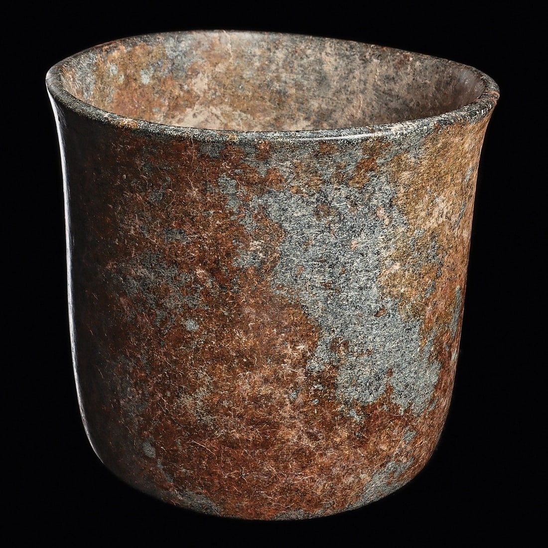 Xochipala Blue-green Stone Cylindrical Bowl: Xochipala, Guerrero region., middle Preclassic, ca. 1150 - 550 BCE. Carved mottled blue-green stone cylindrical bowl having a squared, flared rim.5.75”H x 6.375”W (14.6 x 16.2cm). Provenan