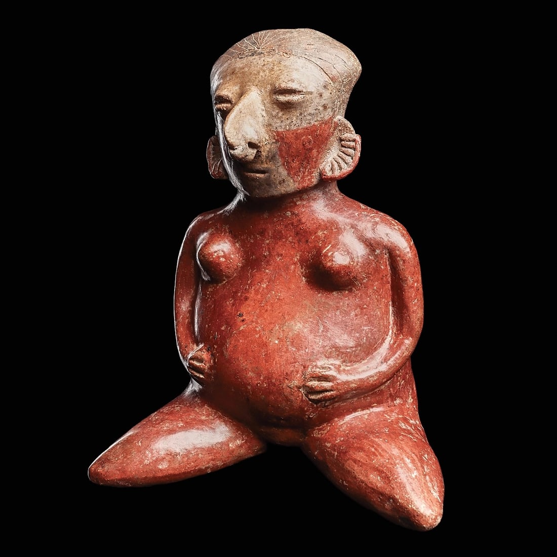 Chinesco “D” Pregnant Woman in Labor: Nayarit, ca. 100 BCE - 250 CE. Red-orange pottery seated pregnant woman in labor, splayed legs, and holding both hands on her large rounded stomach. Fine-line incised hairdo, coffee bean type eyes and