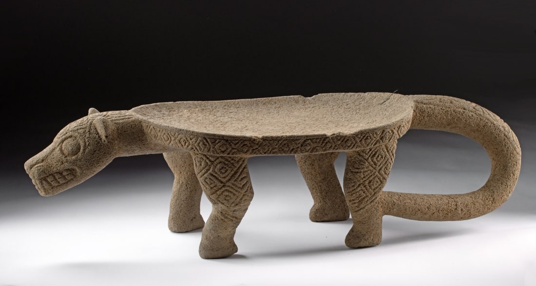 Costa Rican Stone Metate Jaguar, CIRAM: Pre-Columbian, Costa Rica, Atlantic Watershed., ca. 800 - 1200 CE. A very large jaguar effigy metate depicting the wild feline standing on all fours with a broad, slightly convex back/table forming th