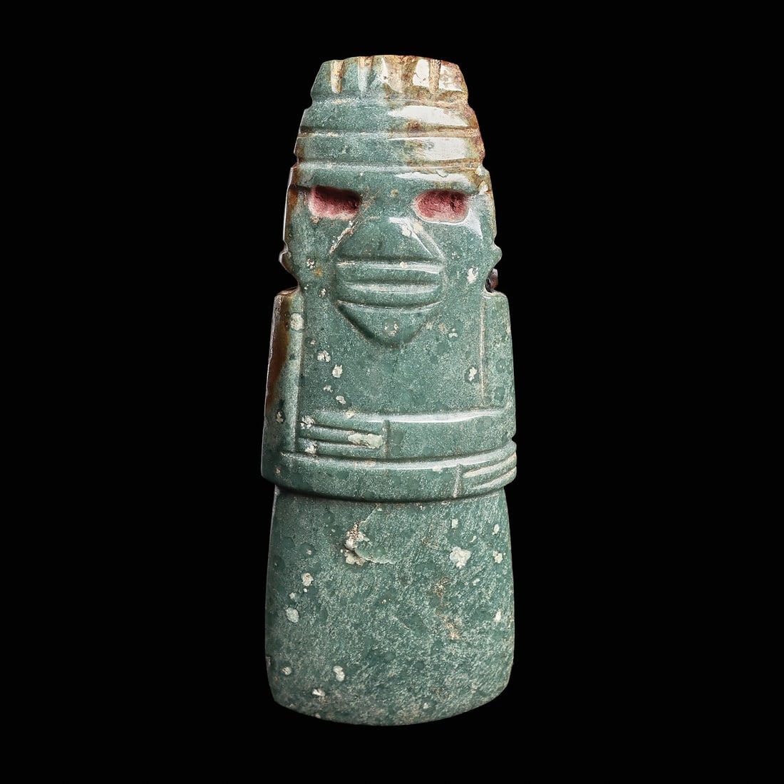 Costa Rican Jade Anthropomorphic Celt Pendant: Costa Rica, ca. 500 - 1000 CE. Carved blue-green jade anthropomorphic celt pendant, depicting a stylized human figure holding both arms across his stomach. Double banded headdress and segmented hairdo