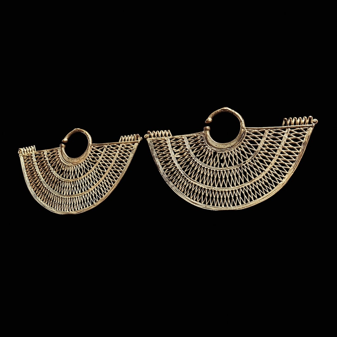 Sinu Large Pair of Gold Filigree Ear Ornaments (2): Sinu, Colombia, ca. 800 - 1450 CE. Large and elegant matching pair of cast gold ear ornaments, crescent fan form with three wide bands of openwork diamond net design, and a zigzag element at the ends 