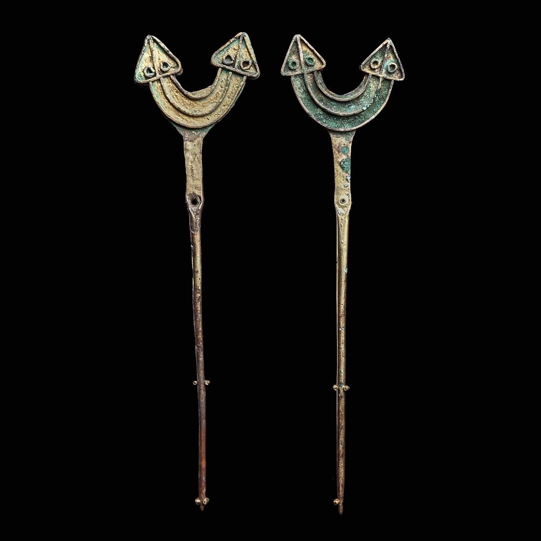 Gilded Gold Double Headed Tupas with Serpent Finials (2): Maranon Jungle, Amazon, ca. 300 - 100 BCE. Matching pair of large gilt over copper tupus, each having a semiabstract design finial depicting a double headed serpent with triangular shape heads, arched