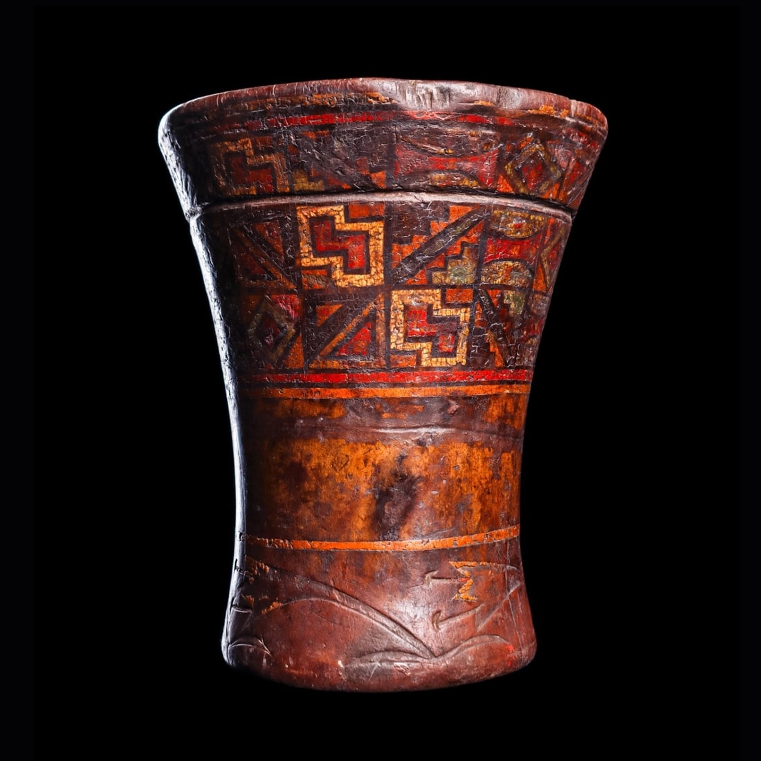 Inca Decorated Kero: Inca Empire, ca. 14th - 15th century CE. Carved wood kero having a incised carved decoration highlighted with the original multicolor resin paint. Decoration depicts a royal Inca textile pattern in th