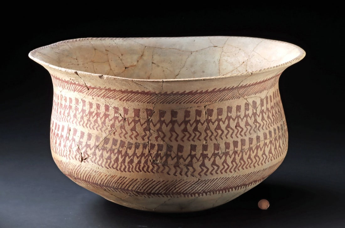 Massive Hohokam Pottery Bowl, Dancing Figures: Southwestern United States, Central and Southern Arizona, Hohokam culture., ca. 950 - 1150 CE. A huge pottery vessel with a warm buff surface decorated in red-brown pigment. Two bands of simplified st