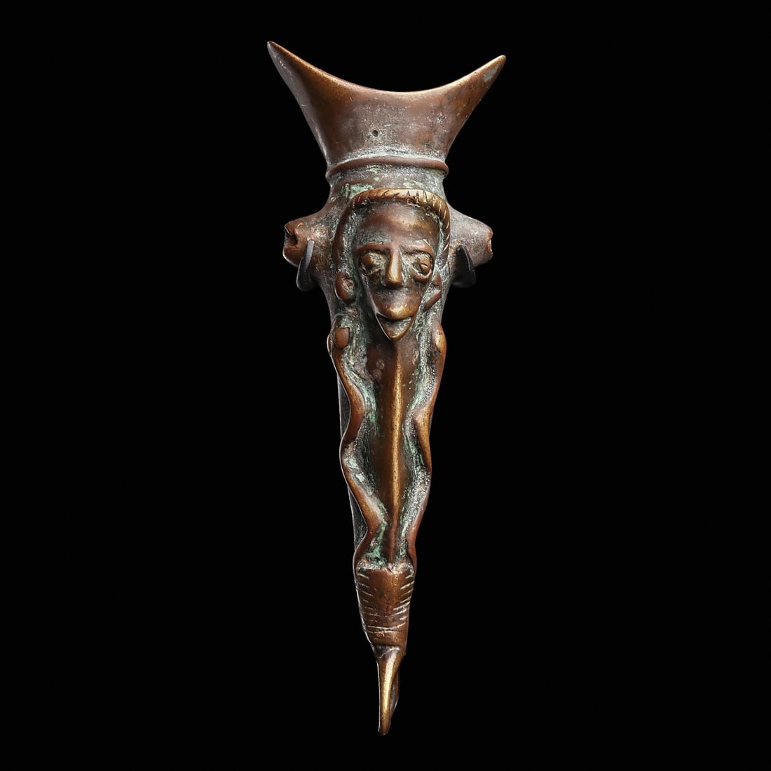 Bronze Gurunsi Whistle: Burkina Faso, . Lost wax cast copper alloy whistle with a crescent-shaped mouthpiece, a prominent projecting anthropomorphic head in front, and relief serpents along sides. Custom base.5.75”H