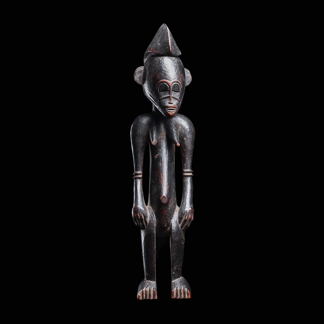 Senufo Figure: Ivory Coast, pre WW II.. From an old French collection. Please note the exceptionally hard wood. Most likely pre-1930. Reserve: $250.00.16.5”H (41.9cm). Provenance: Private CA. collection, ex.