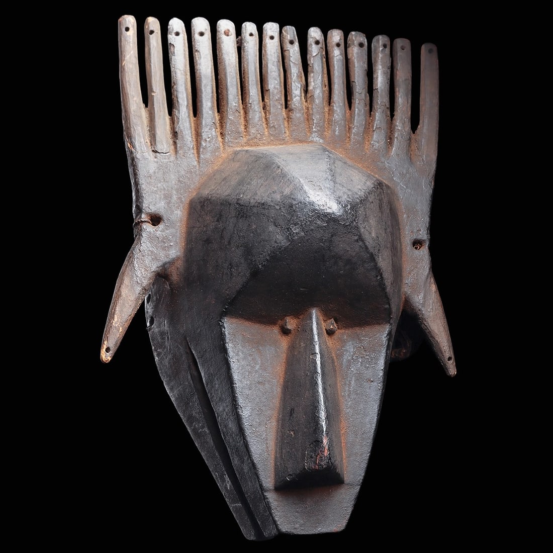 Bamana N’tomo Mask: Mali, . 1963.852 Mali Bamana N'Tomo Society mask, Unknown Wood, string, metal. 33.7 x 22.9 x 16.6 cm (13-1/4 in. X 9 in. X 6 1/2 in.) Mr. And Mrs. Herbert Baker, gift.13.25”H (33.7cm).