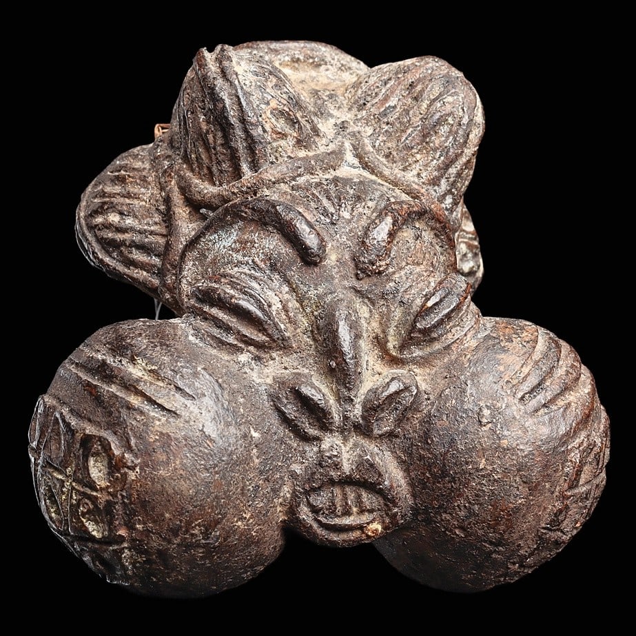 Grassfields Bronze Portrait Pipe: Cameroon, . Puffy enlarged cheeks are characteristics of a notable, a prestigious figure within the community.4”H (10.2cm). Provenance: Marshall & Caroline Mount Collection, N.J. Notice: We