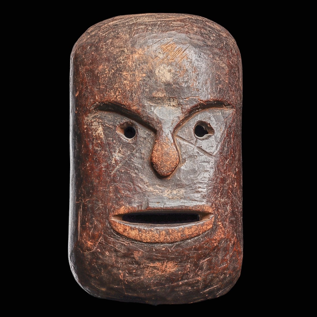 Hehe Mask: Tanzania, . Carved in block-like form, small round eyes, parted mouth, flat diminutive nose, with angular incisions framing the eyes. Hehe art is found to be rare, and not often found on the