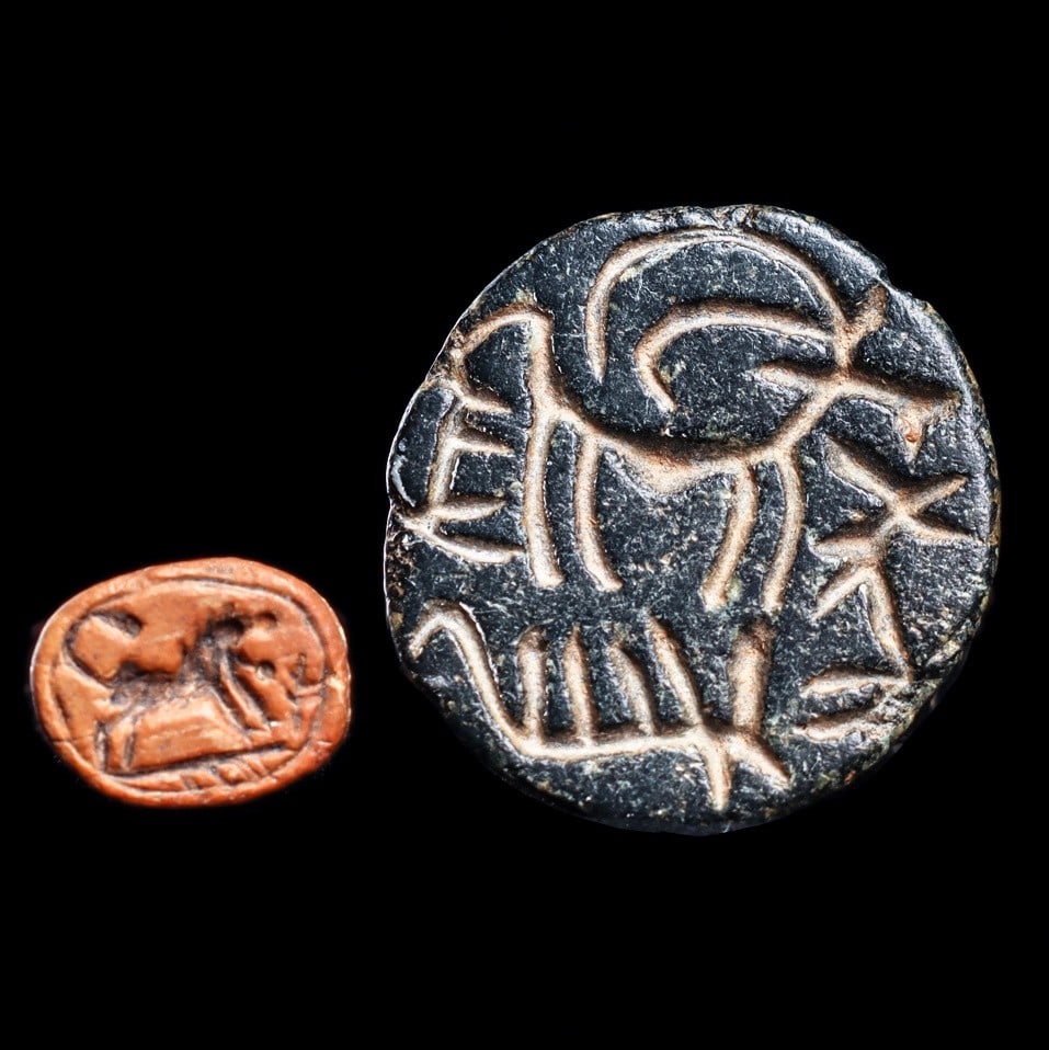 Anatolian Steatite Goat Stamp Seal & Lion Scaraboid: Goat stamp: Southeastern Anatolia. Lion Scaraboid found in Israel., ubaid Period, ca. 6th - 5th millennium BCE for horned animal. Scaraboid, ca. 1st millennium BCE. Two different examples, including a